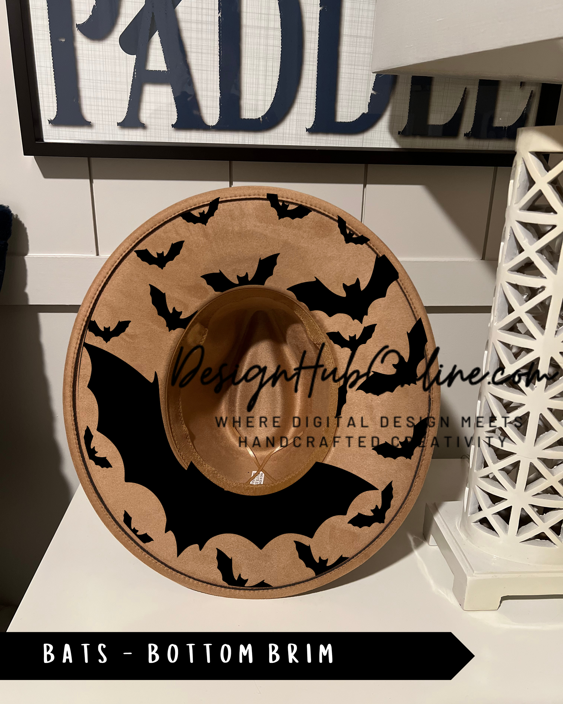 A hat with a bat design on it, displayed on a shelf.