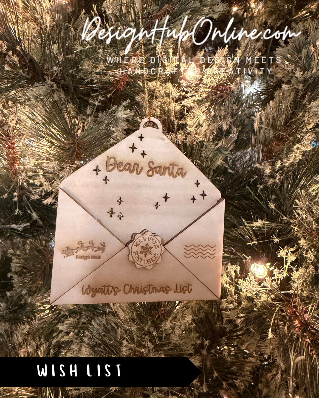 A wooden ornament shaped like an envelope with a wish list message inside, hanging on a Christmas tree.