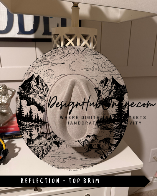 A hat with a mountain landscape design printed on it, displayed on a white dresser.