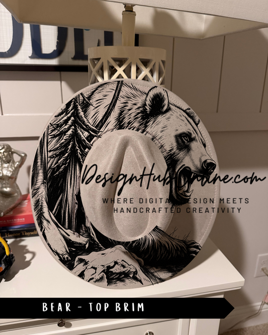 a black and white illustration of a bear on a hat, with text that reads "Design Hub" and "Where digital design meets handcrafted creativity". The hat is placed on a white dresser, and there is a lamp in the background.