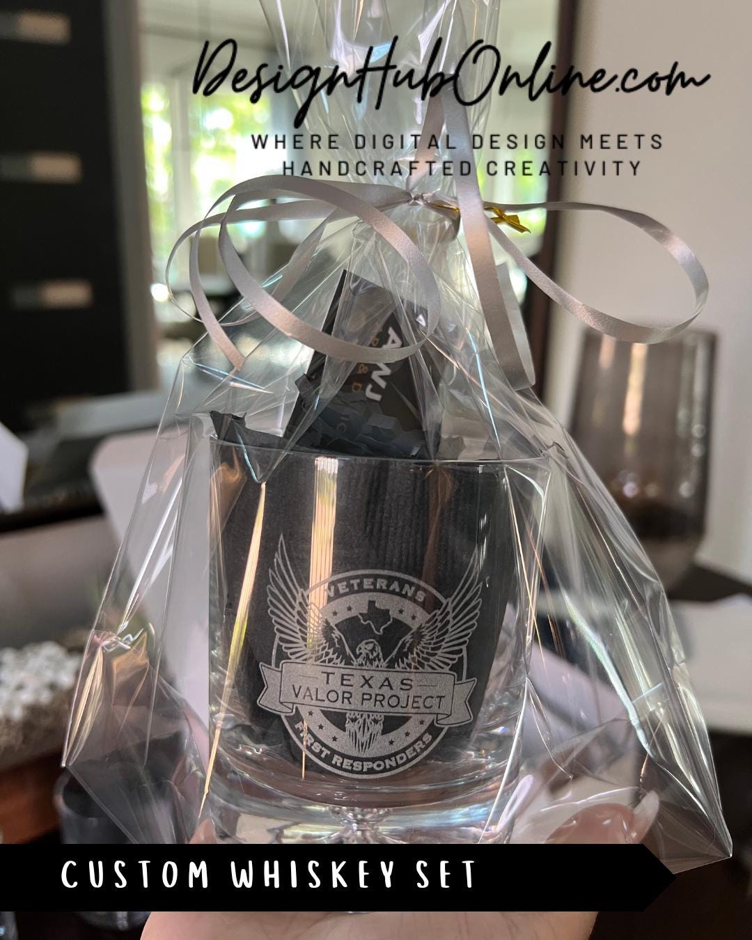 A clear glass set containing a whiskey glass with a custom design, presented in a clear plastic bag.