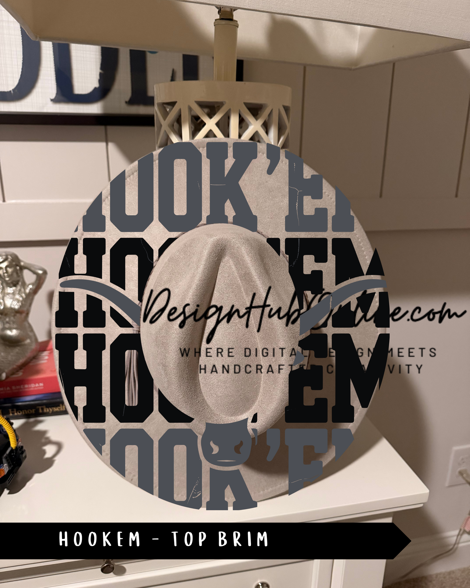 A decorative wall hanging with the word "HOOKEM" prominently displayed in large letters, surrounded by other text and imagery.