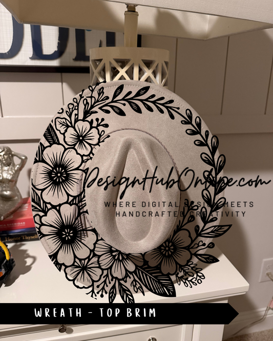 A decorative white hat with a floral design, hanging on a white shelf.