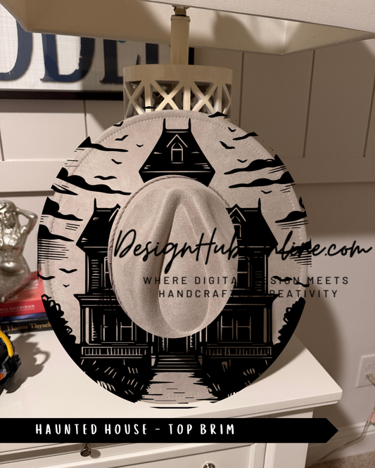 A hat with a black and white illustration of a house and a castle, resembling the Haunted House from the movie "Haunted House".
