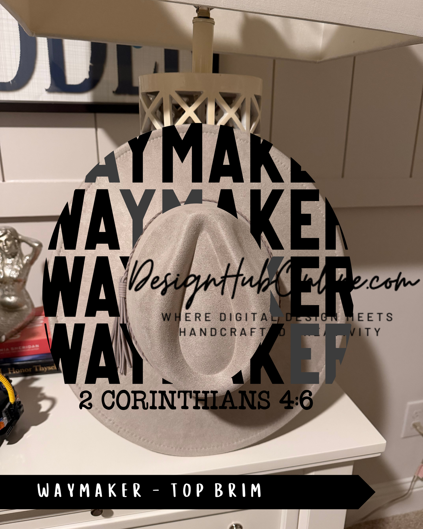 a white hat with the text "WAYMAKER" and "TOP BRIM" printed on it, along with a website address "DesignHUB.COM" and a tagline "WHERE DIGITAL DESIGN MEETS HANDCRAFTED VIVacity".