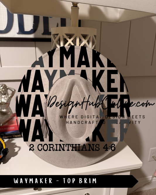a white hat with the text "WAYMAKER" and "TOP BRIM" printed on it, along with a website address "DesignHUB.COM" and a tagline "WHERE DIGITAL DESIGN MEETS HANDCRAFTED VIVacity".