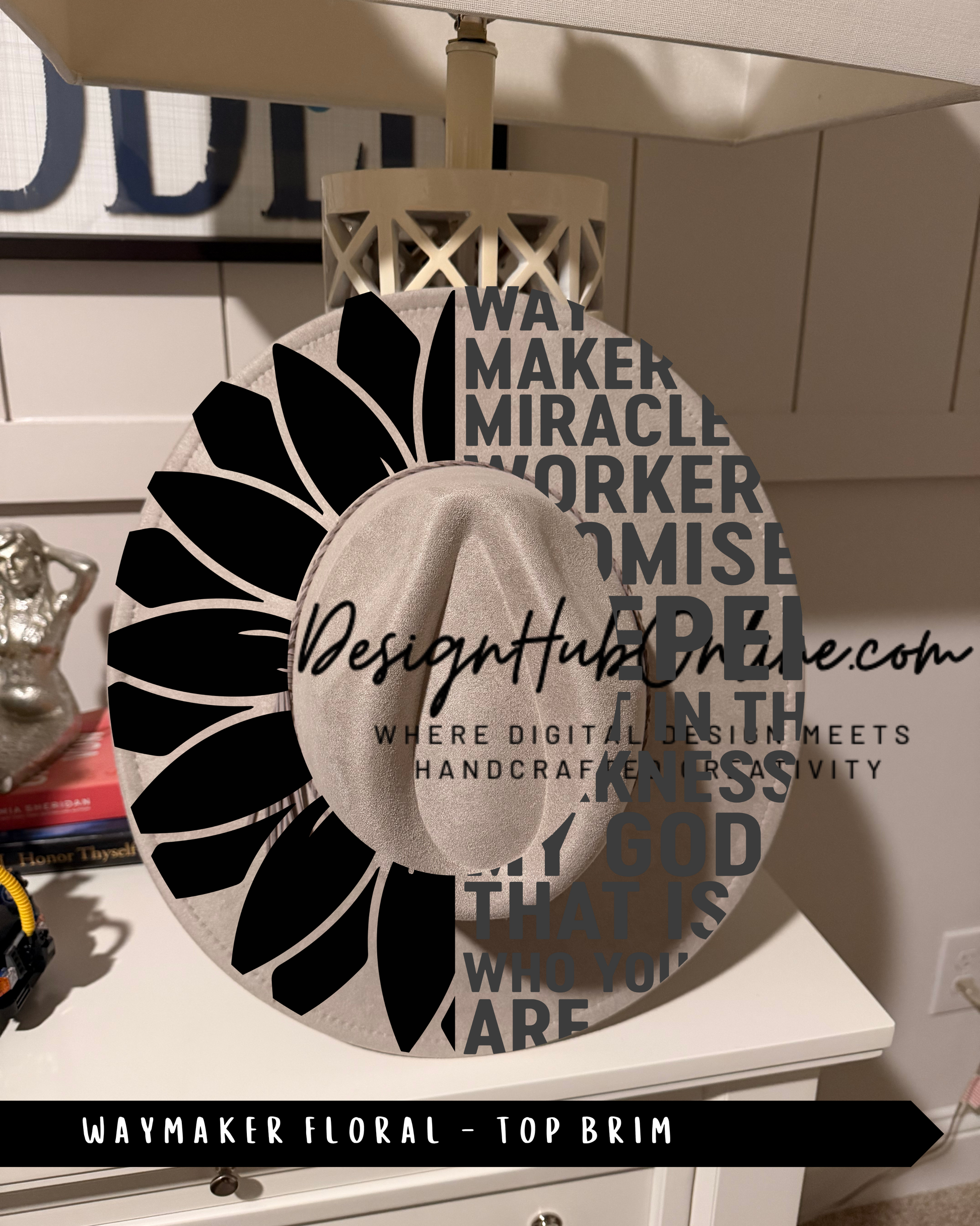 A Waymaker Floral - Top Rim hat with a sunflower design and the text "DesignHUB ONLINE" printed on it.