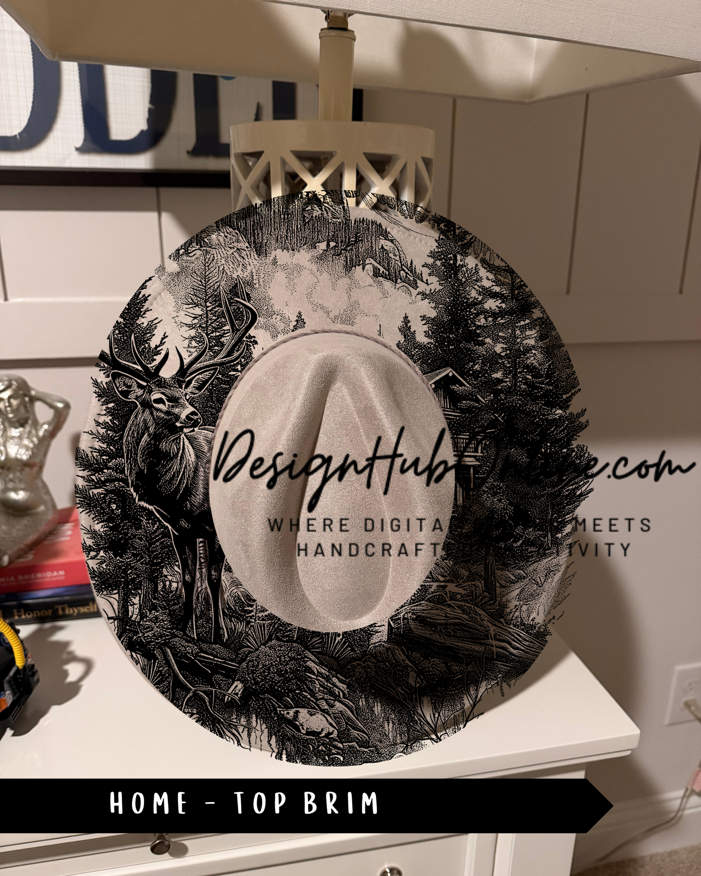A black and white illustration of a deer in a forest setting, with the text "Design Hub" and "Where digital meets handicraft" printed on it.