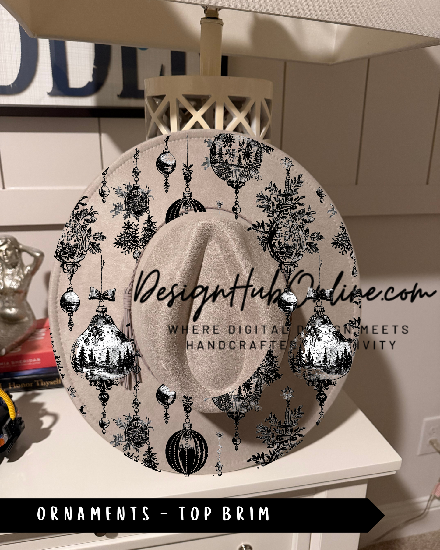 A decorative hat with a black and white pattern of ornaments and a top brim, displayed on a white surface.